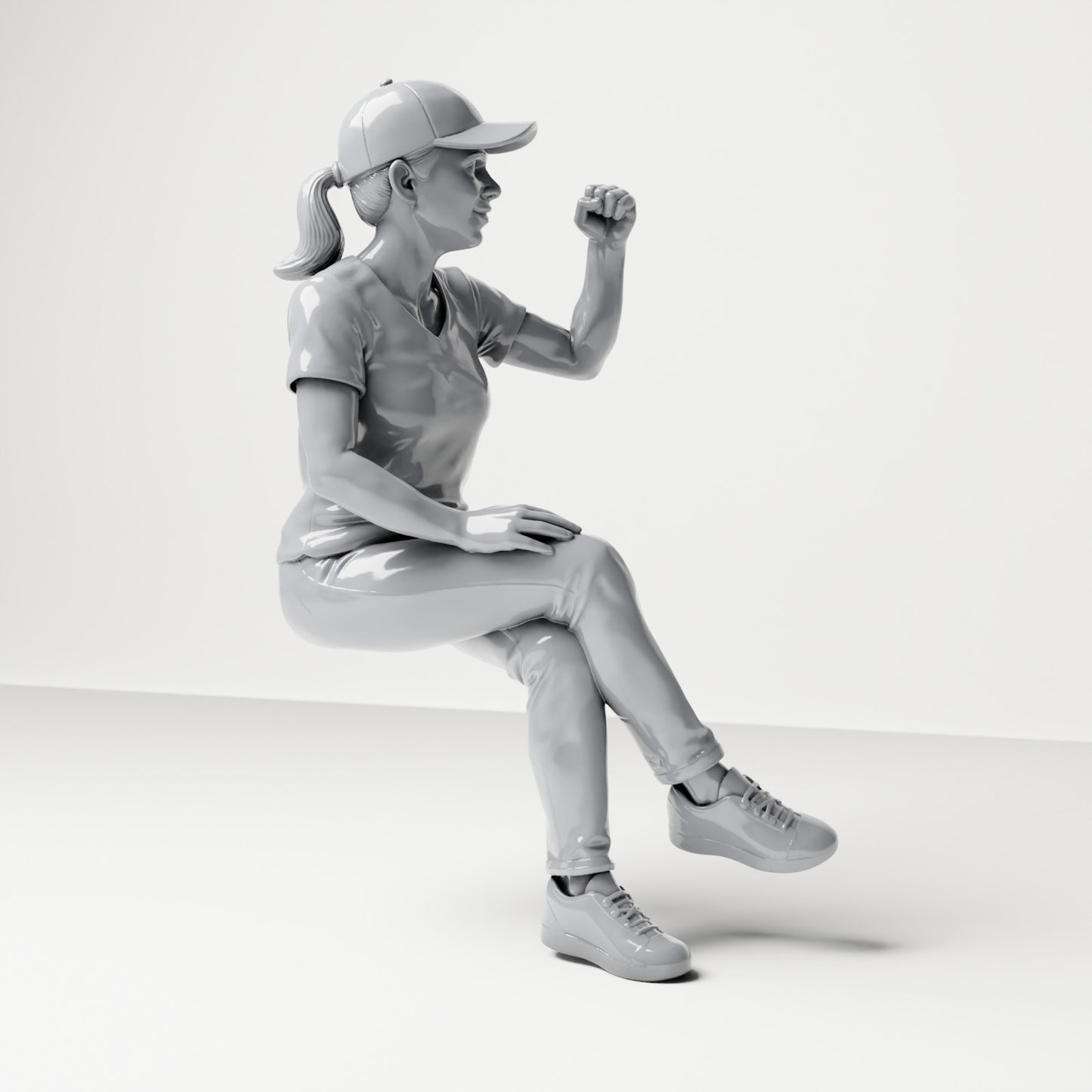 Photo produit de modélisme pour diorama 3 : figurine assise : spectatrice aux jambes croisées et au poing levé (B057)