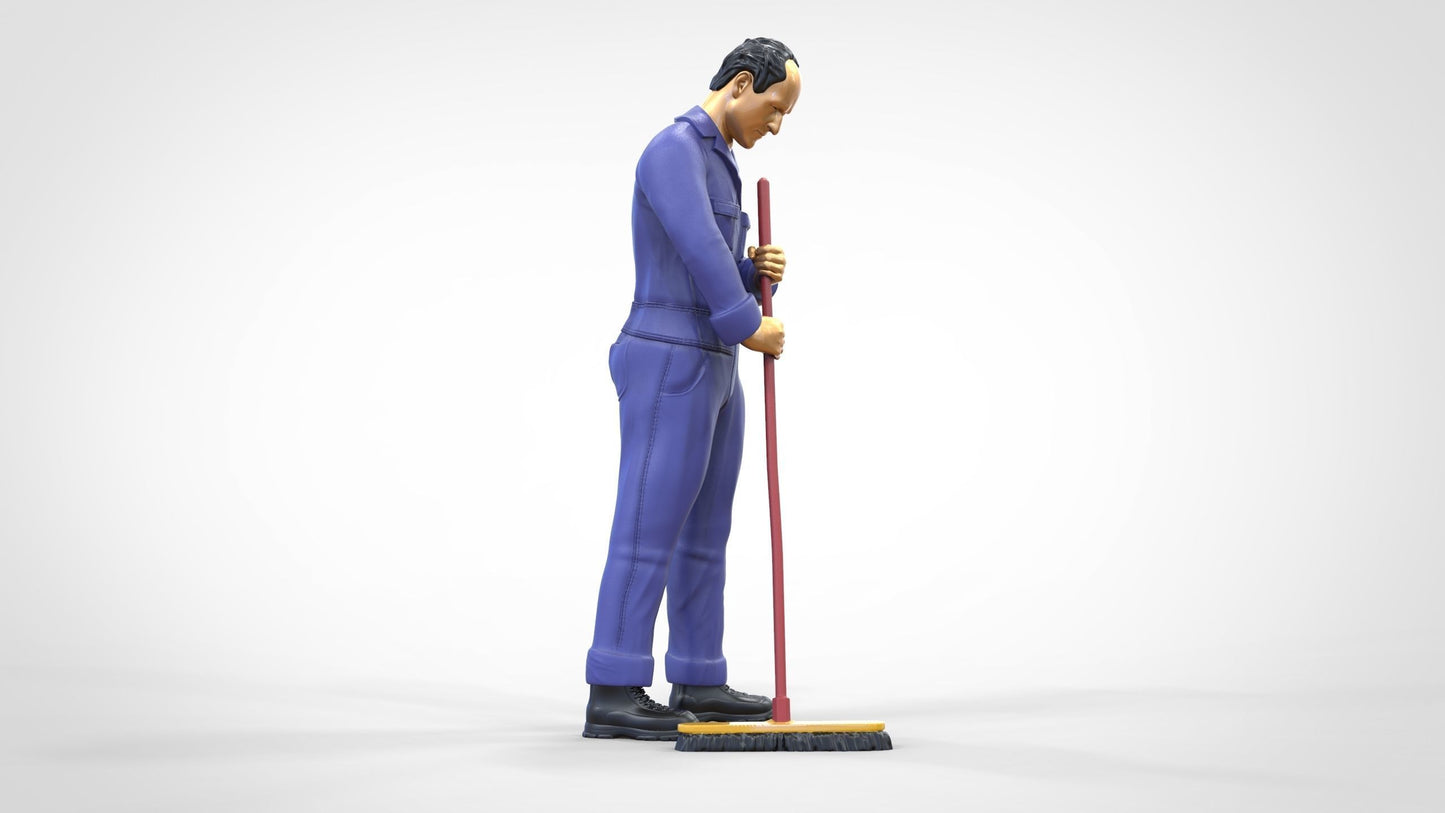 Photo du produit 0 : Gardien ou agent d'entretien : homme avec un balai en combinaison