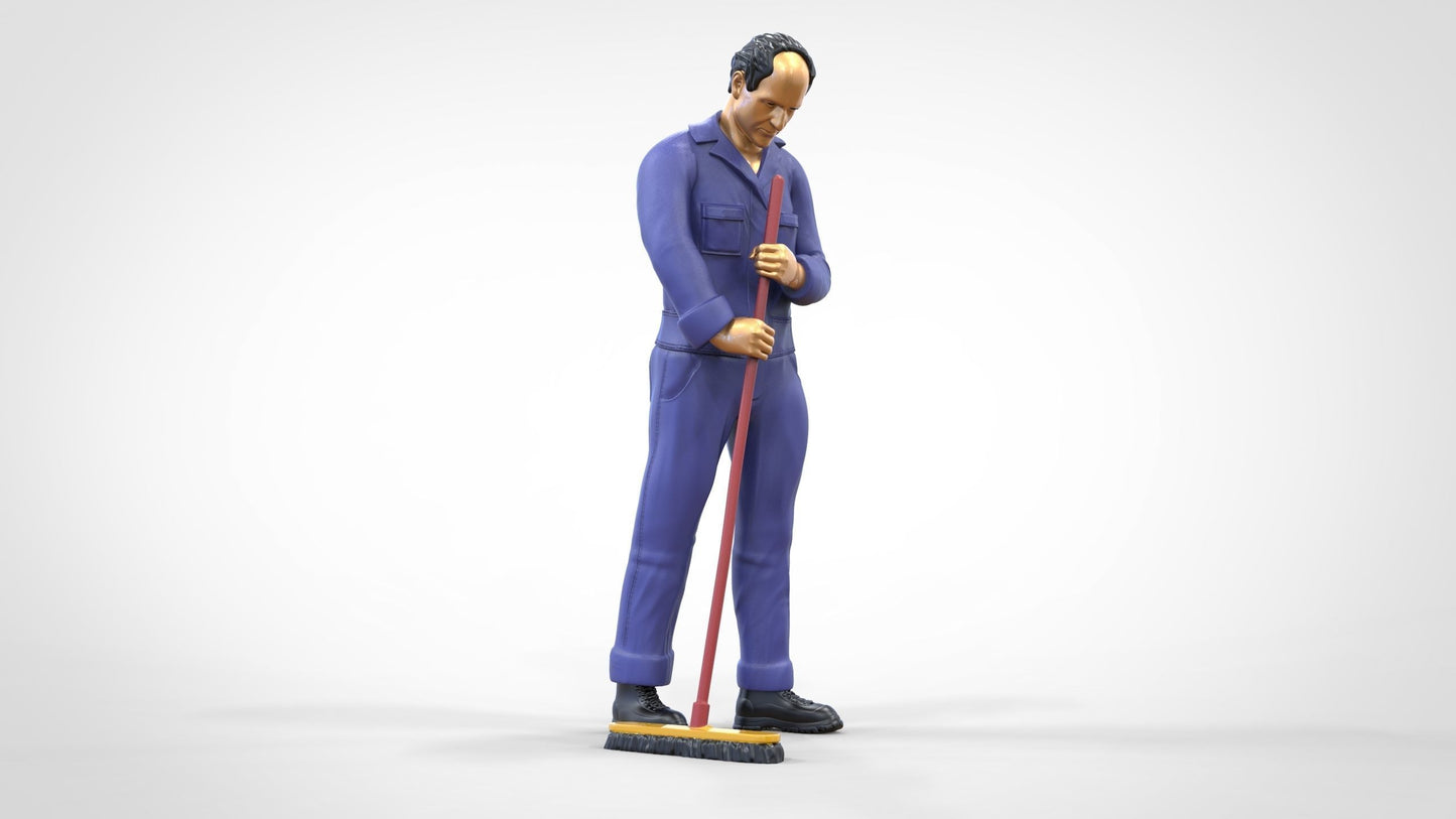 Photo du produit 0 : Gardien ou agent d'entretien : homme avec un balai en combinaison