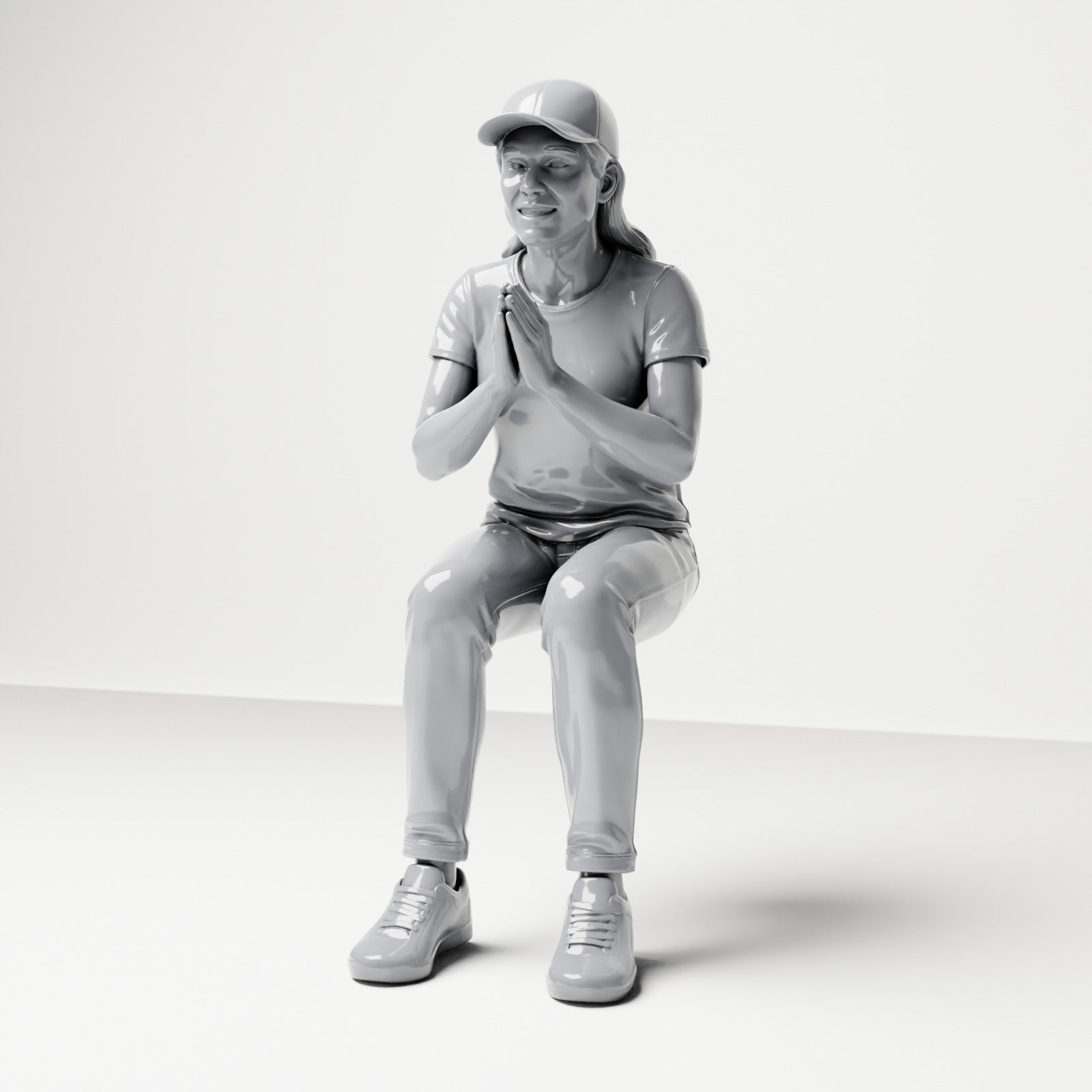 Photo produit de modélisme pour diorama 0 : figurine assise, spectatrice aux mains jointes devant la poitrine (B058)