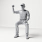 Photo produit de modélisme pour diorama 0 : figurine assise, spectateur levant le poing serré (B066)