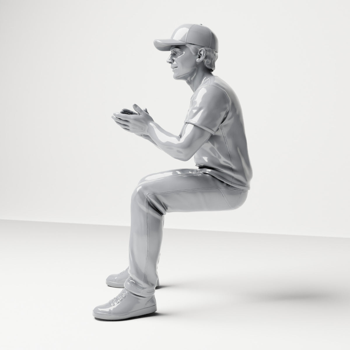 Photo produit de modélisme pour diorama 1 : figurine assise : spectateur masculin avec casquette et mains jointes (B068)