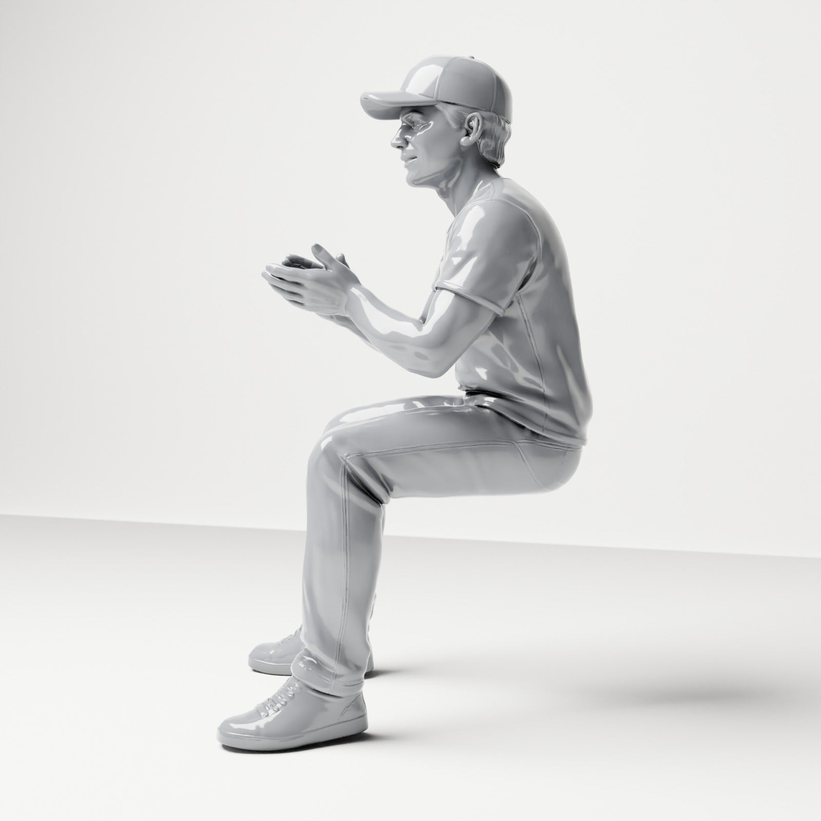 Photo produit de modélisme pour diorama 1 : figurine assise : spectateur masculin avec casquette et mains jointes (B068)