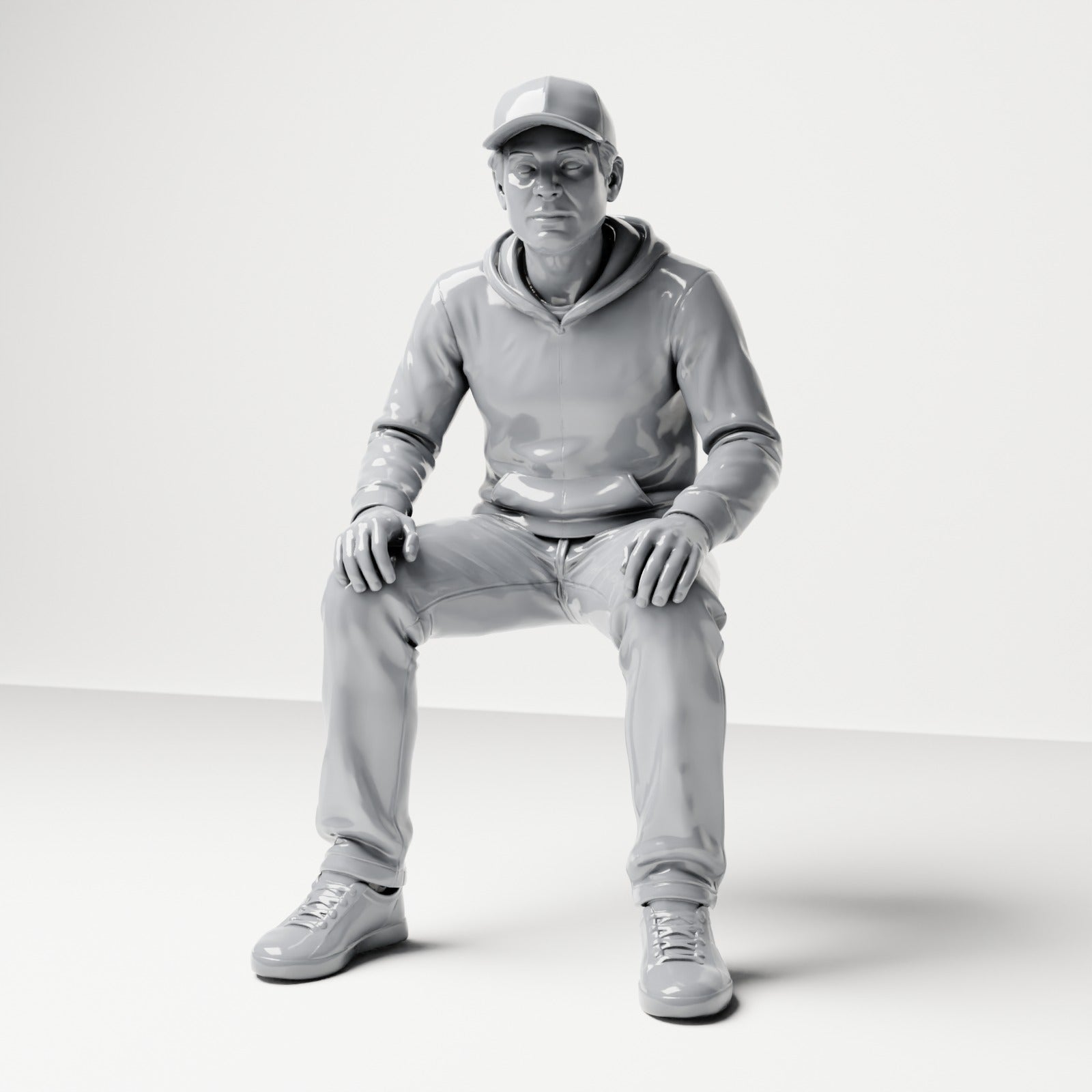 Photo produit de modélisme pour diorama 0 : figurine assise : homme avec casquette et sweat à capuche (B070)