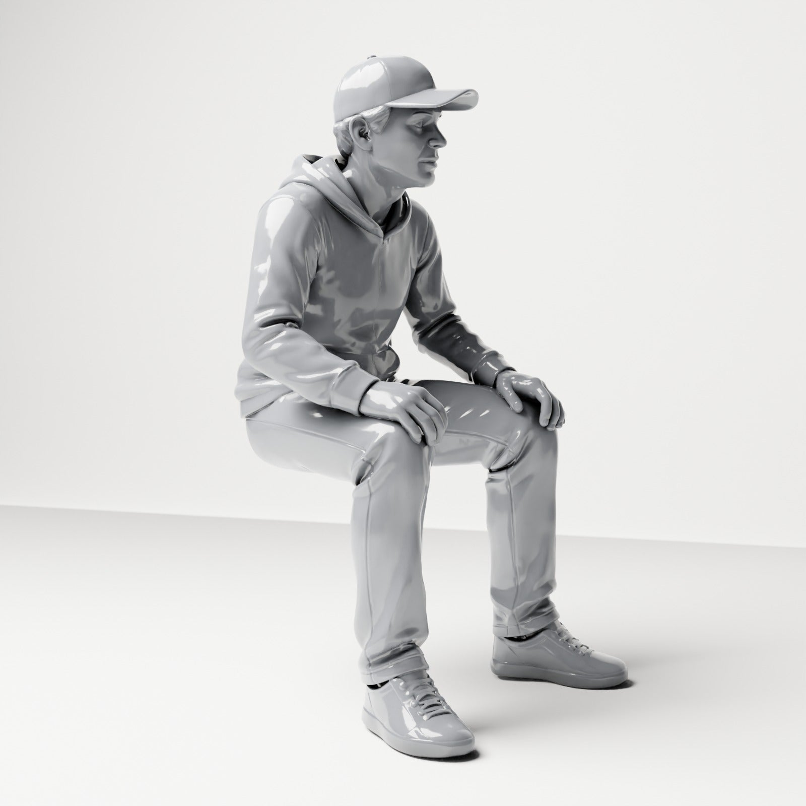 Photo produit de modélisme pour diorama 3 : figurine assise : homme avec casquette et sweat à capuche (B070)