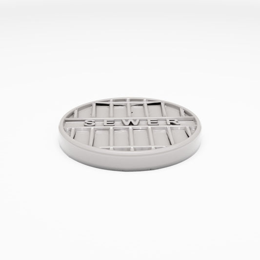 Photo produit pour diorama et modélisme 0 : Diorama de rue : Tampon de regard en fonte « SEWER » (Ref. 1042D)