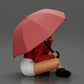 Diorama Modélisme Photo de produit 1 : Miniature de diorama : Femme assise en veste et short avec un parapluie ouvert (Ref Nr. A85)