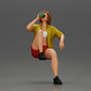 Diorama modélisme photo produit 1 : Miniature : Femme jeune assise sur une chaise, jambe repliée, buvant dans une tasse (Ref Nr. A57)