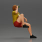 Diorama modélisme photo produit 2 : Miniature : Femme jeune assise sur une chaise, jambe repliée, buvant dans une tasse (Ref Nr. A57)