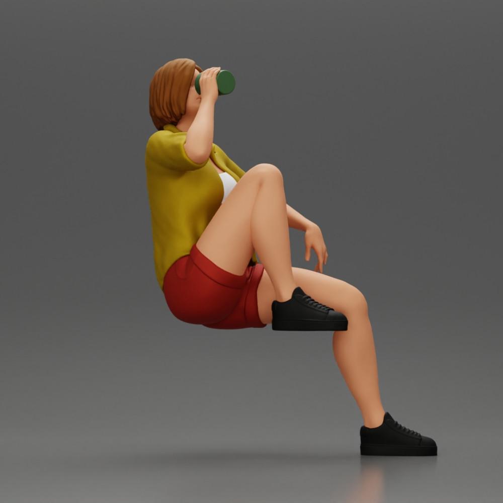 Diorama modélisme photo produit 2 : Miniature : Femme jeune assise sur une chaise, jambe repliée, buvant dans une tasse (Ref Nr. A57)