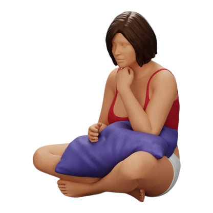 Diorama modélisme photo produit 0 : Fille assise devant la télévision avec des coussins sur les jambes (Réf n° A36)