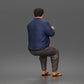 Photo produit de modélisme pour diorama 5 : figurine assise : homme gesticulant avec pull, pantalon et tongs (a165)