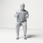 Photo produit de modélisme pour diorama 7 : Figurine assise : homme gesticulant avec pull, pantalon et tongs (a165)