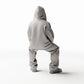Diorama Modellbau Produktfoto 0: Sitzende Figur: Mann in Hip-Hop Kleidung mit Kapuzenjacke, Mütze und weiter Hose (Ref. Nr. 531)